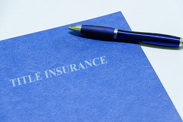 Title insurance folder on desk